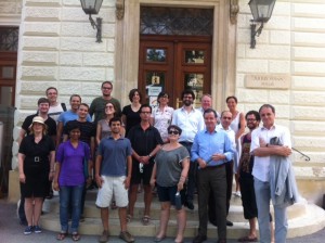 In front of the Julius Hann Haus building at ZAMG, from left to right: Professor Sabine Koch, Bastian Stoppelkamp, Dimitri Putilin, Rodolfo Hernandez, Miral Shah, Jakub Motrenko, Laszlo Kosolosky, Marina Pacchetti, Matt Panhans, Professor Wendy Parker, Dr. Christoph Matulla, Dehlia Hannah, Kimberly Brumble, Professor Roman Frigg, Professor Jim Flemming, Dr. Micael Staudinger, Professor Karoly Kokai, Dr. Christa Hammerl, Martin Vezér, Professor Fredrich Stalder. (Photo courtesy of ZMAG blog.)]