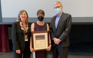 Pauline Barmby holds her Distinguished University Professor award with Sarah Pritchard, and Alan Shepard, Western University Provost and President, respectively