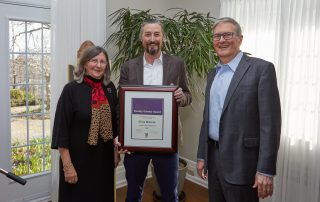 Chris Smeenk holds his faculty scholar award with Sarah Pritchard, and Alan Shepard, Western University Provost and President, respectively