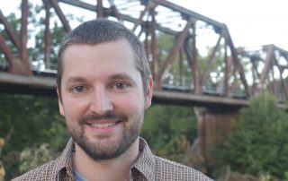 Ed Baggs in front of bridge