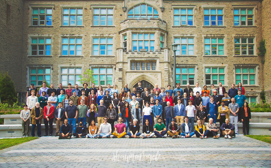 Group photo of QISS2022 conference attendees in front of Physics & Astronomy Building
