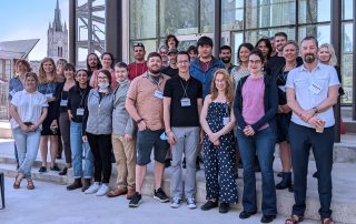 Group photo of RGSC2022 conference attendees on patio behind WIRB