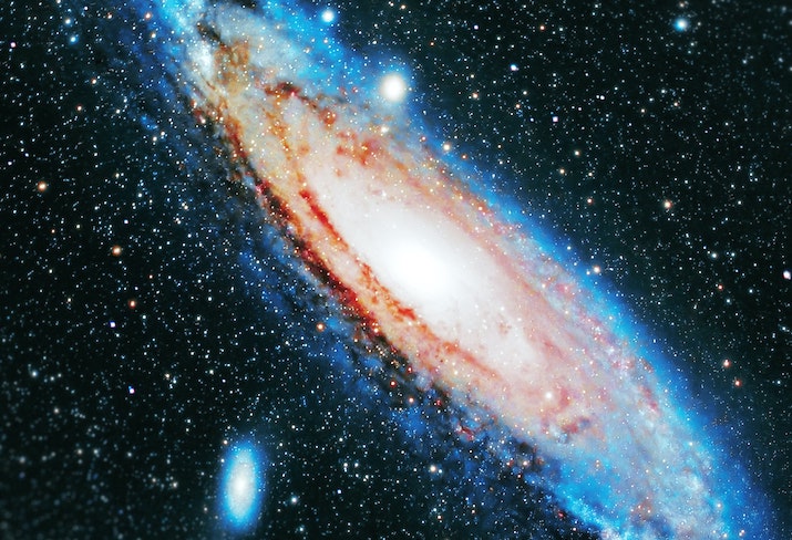 Blurred background with the Andromeda Galaxy (Andromeda Nebula) in high resolution.